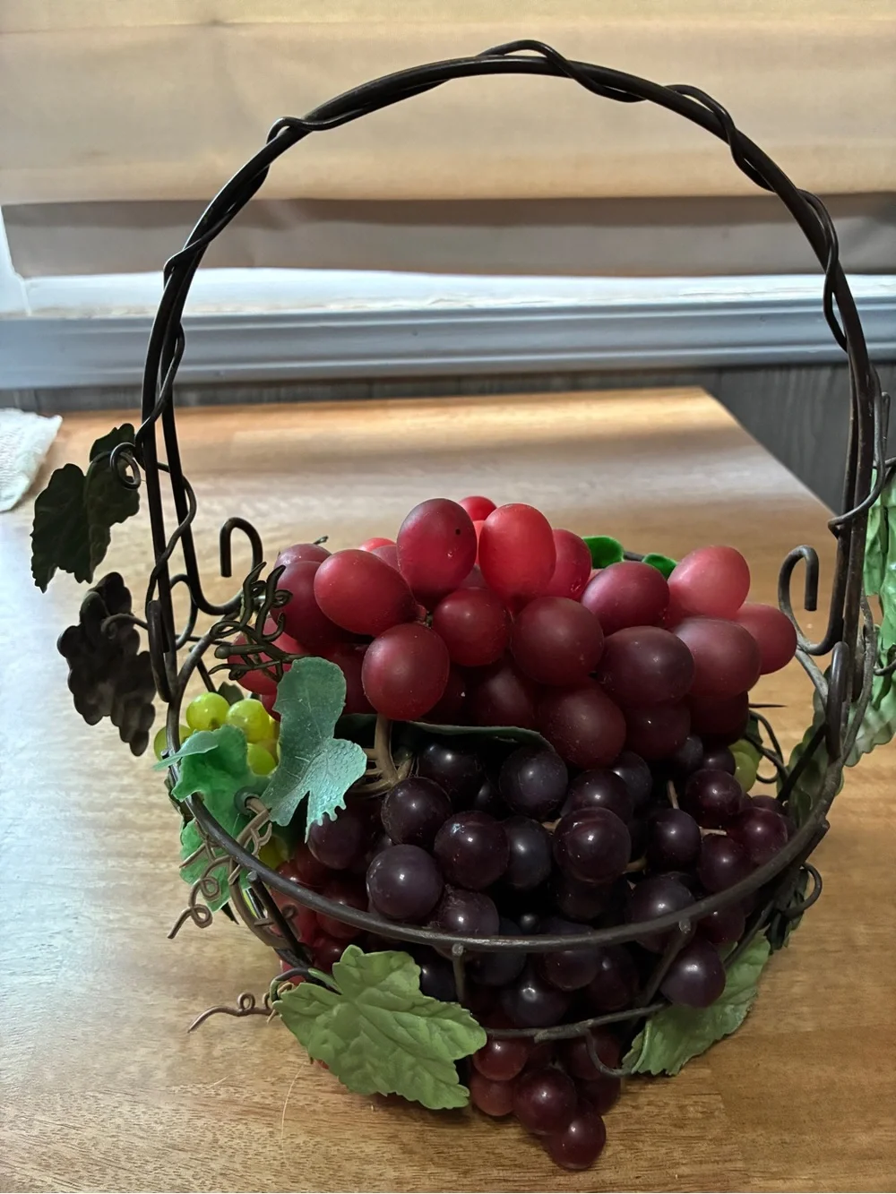 decorative artificial grape clusters, in a wire basket 8” x 10”